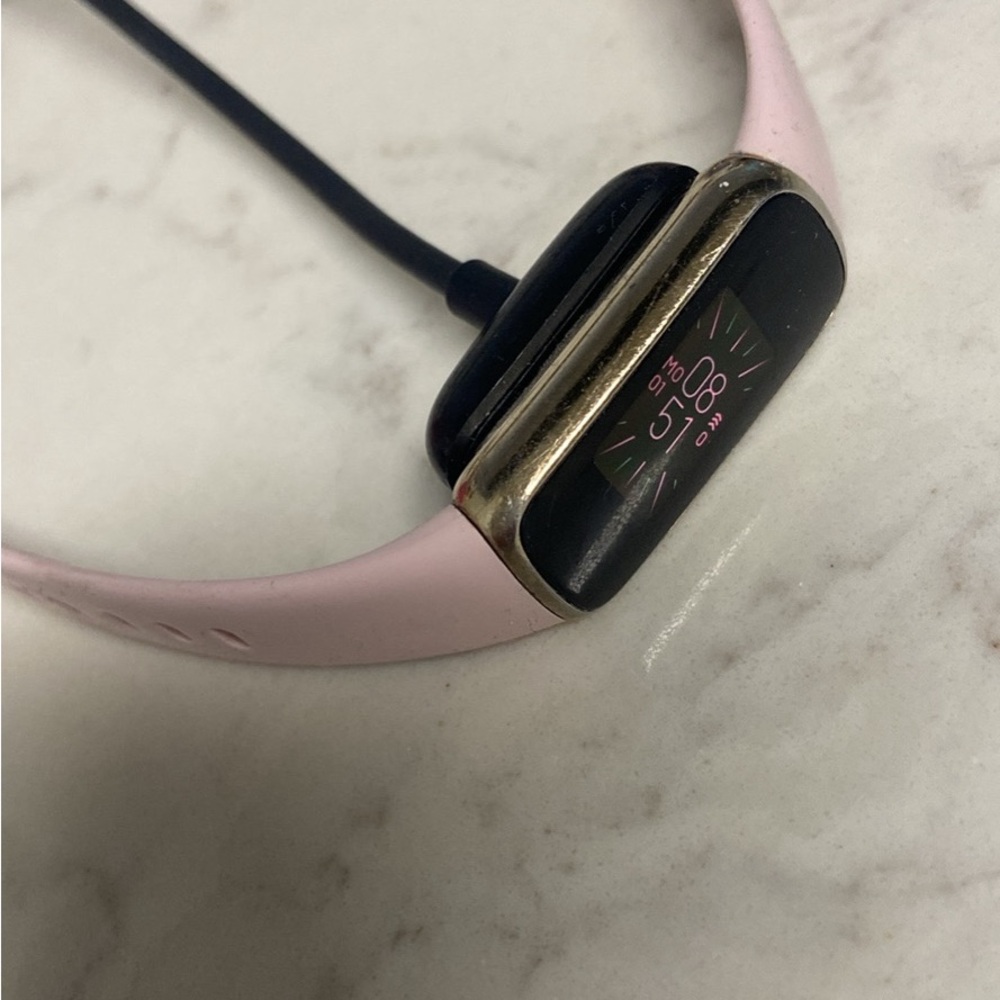 GUC Fitbit Smartwatch with Pink Band and Black Display
